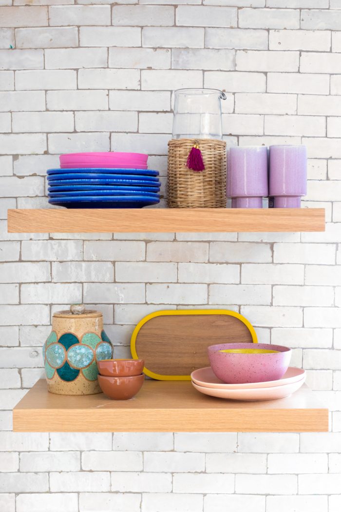 Colorful Dishes on Kitchen Shelves
