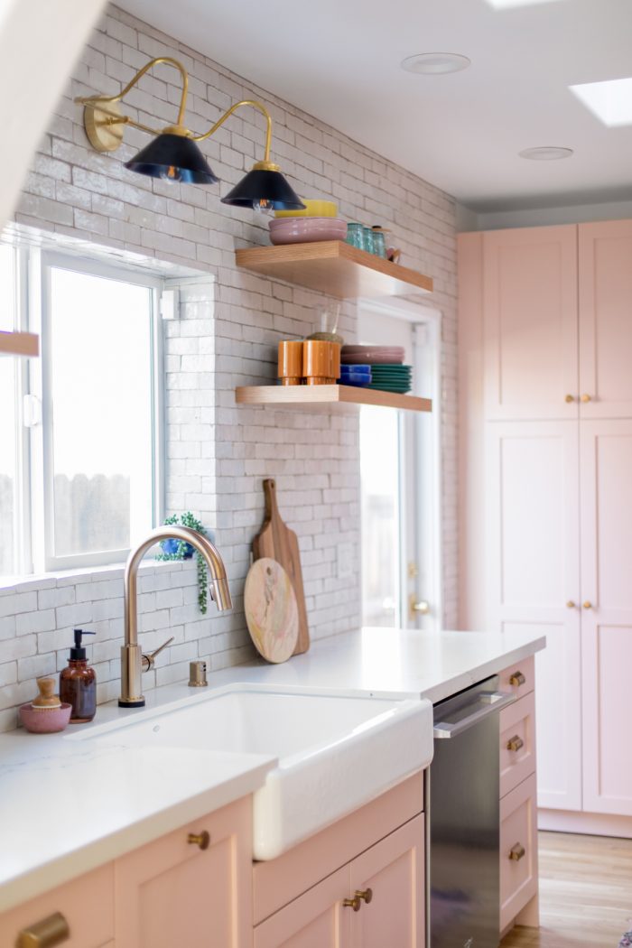 A kitchen with a sink and a window