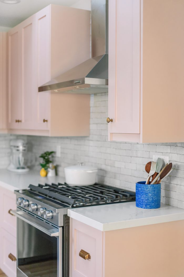 A stove top oven sitting inside of a kitchen