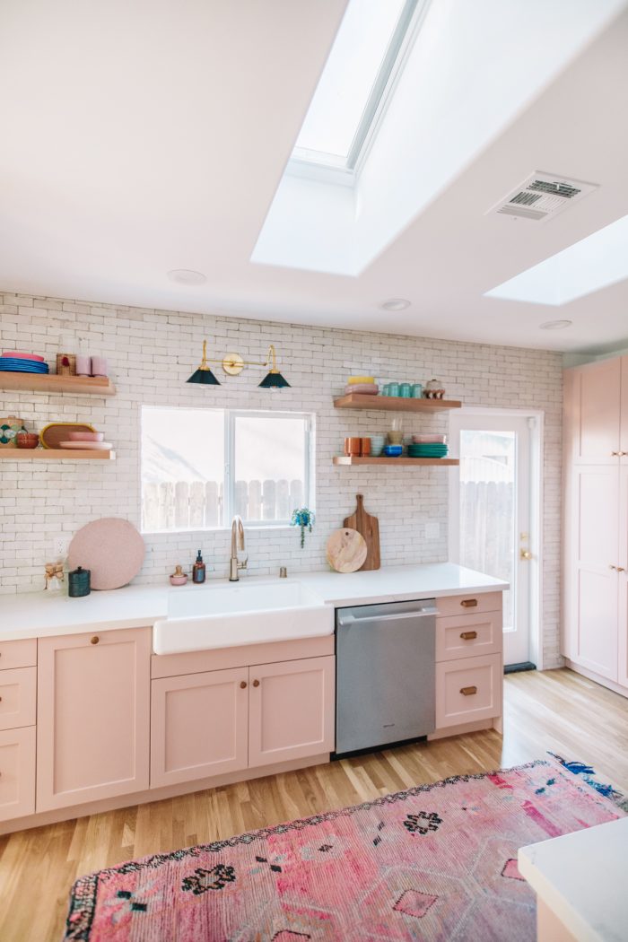 A kitchen with a sink and a window