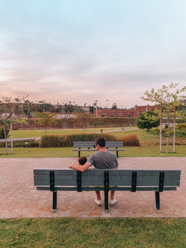 A person sitting on a park bench