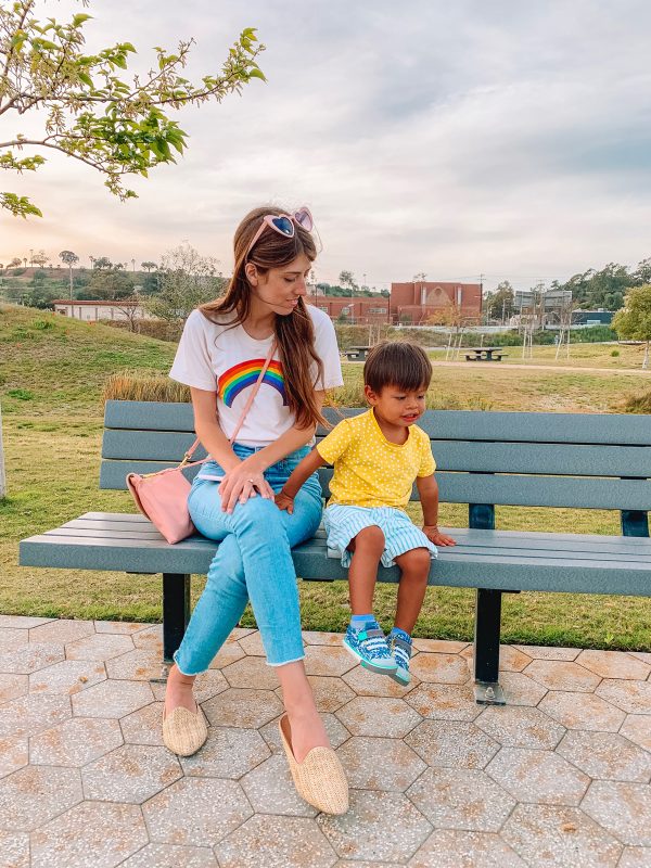 Two people sitting on a park bench