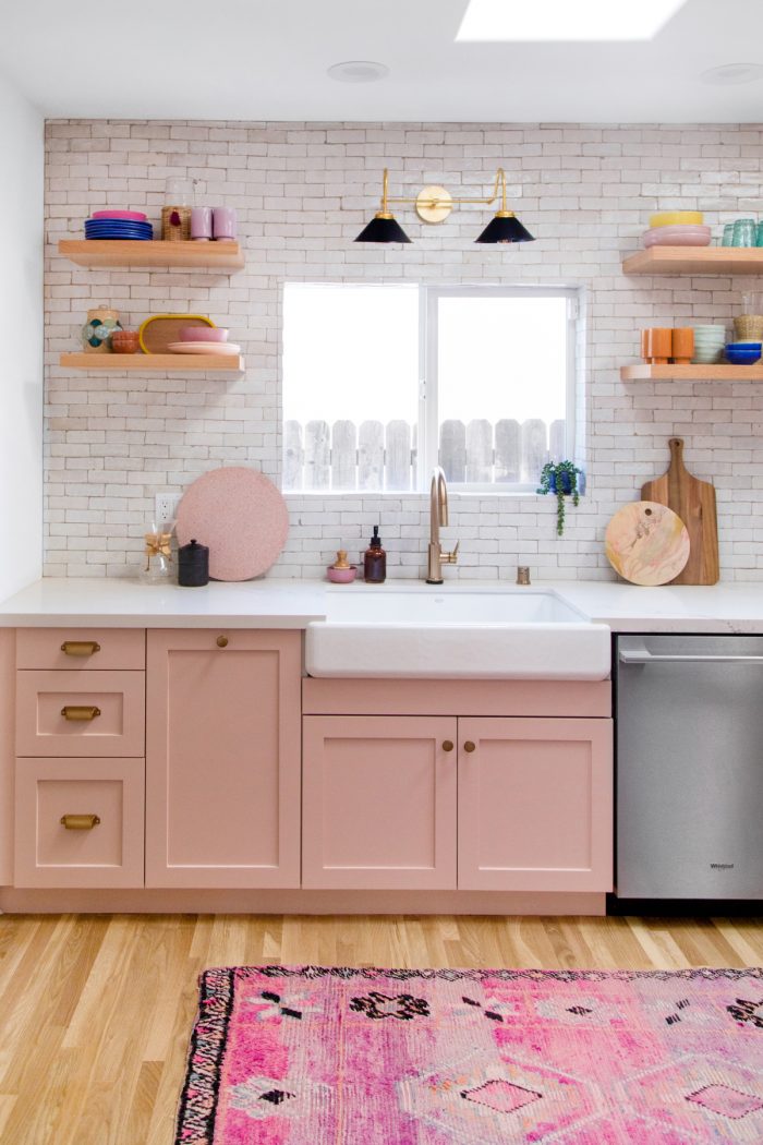 A kitchen with a sink and a window