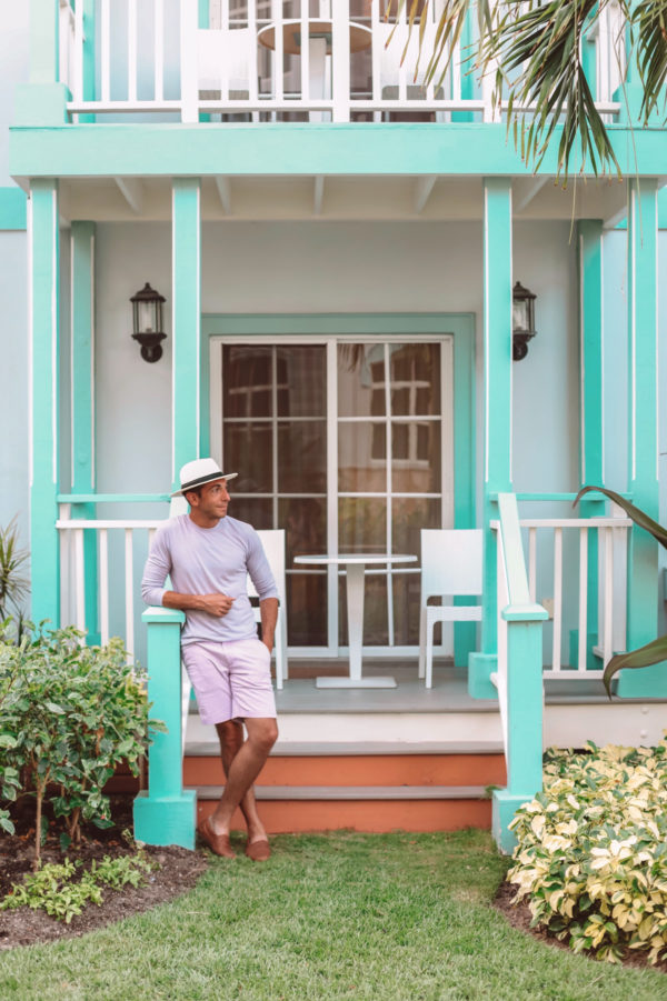 A person standing in front of a house