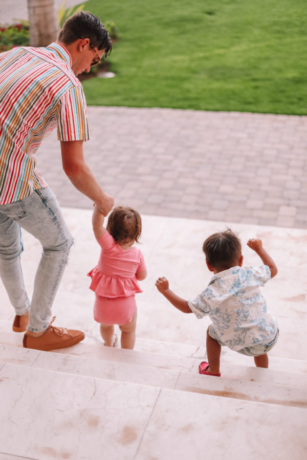 Two kids walking down the stairs