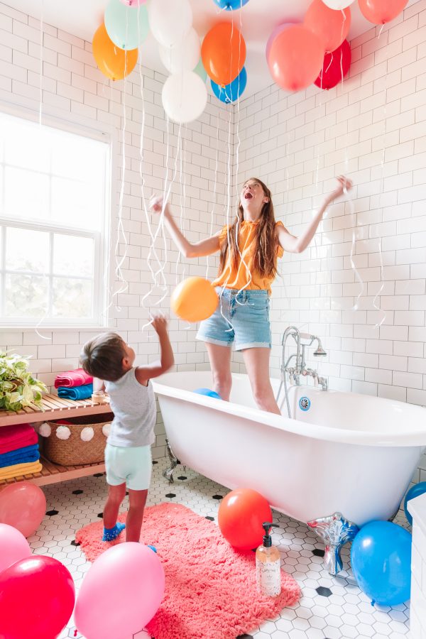 A woman standing in a bathtub