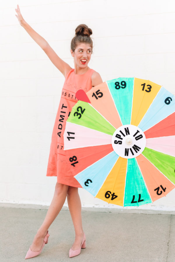 Someone holding a colorful wheel