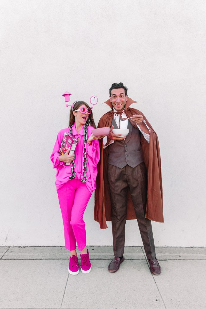 Man and woman holding a costume
