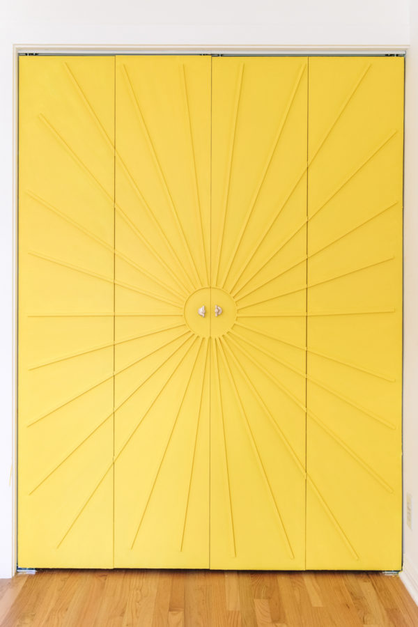 A close up of a yellow door