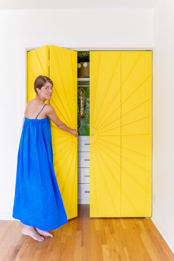A person standing in front of a Closet Door