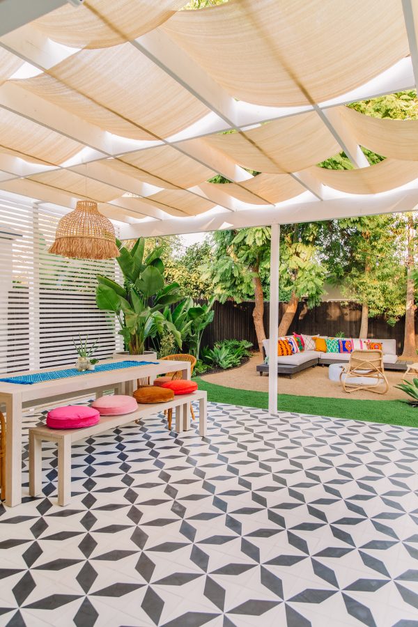 colorful backyard with white shaded pergola