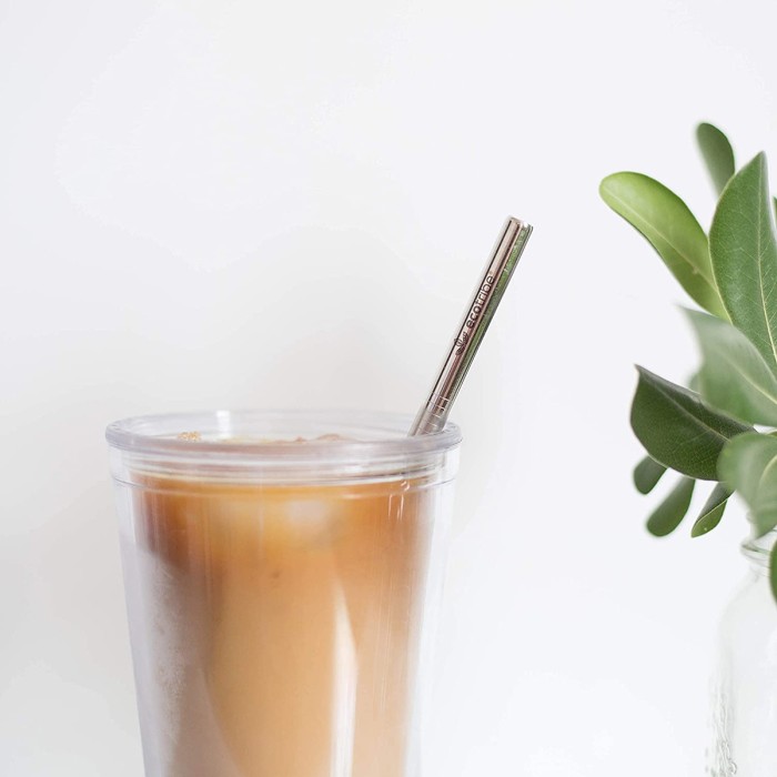 Coffee cup with metal straw
