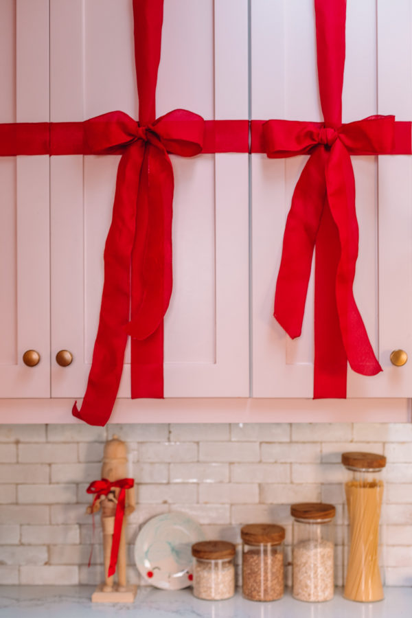 Red ribbons on pink cabinet 