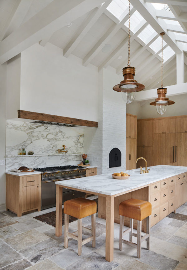 A kitchen with wooden cabinets and a dining room table
