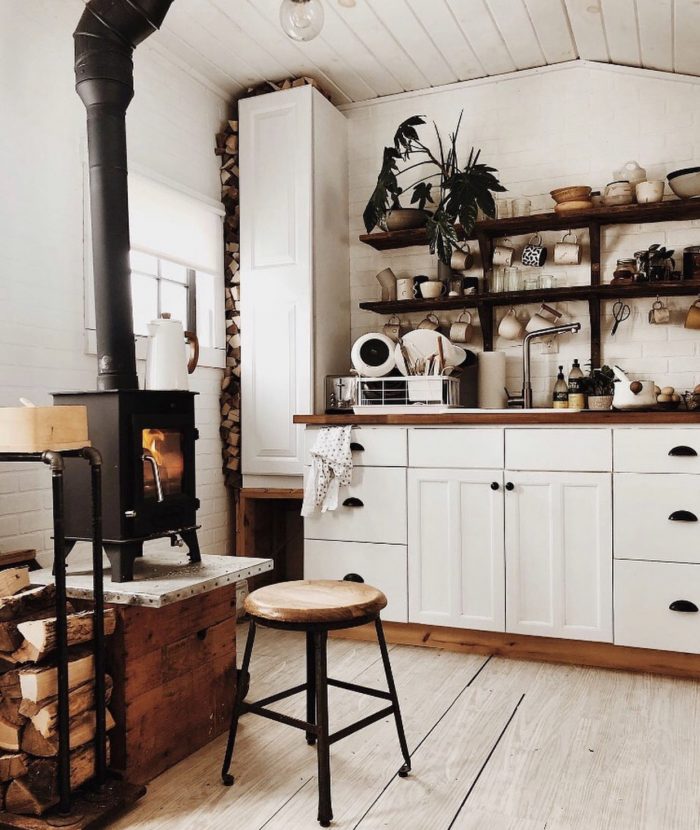 A room with cabinets and a fireplace