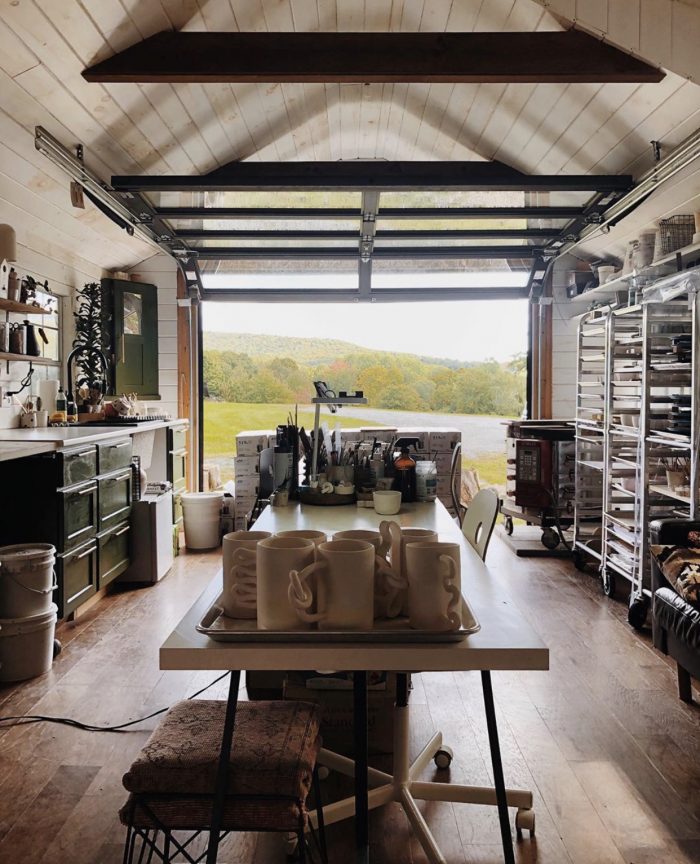 A tiny home with tables and cabinets