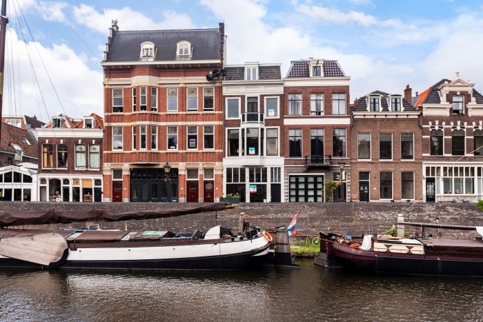 Boats docked next to buildings