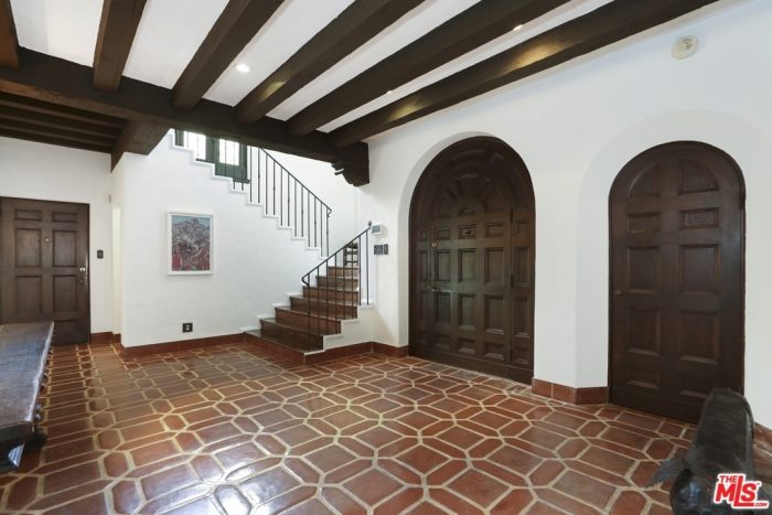 A room with tile and stairs