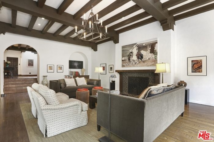 A living room filled with furniture and a fireplace