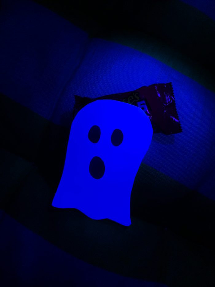 A ghost with a blue light shining on it