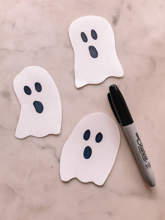 Black Light Halloween Candy Hunt with Paper Ghosts