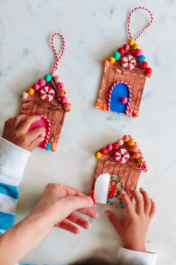 Three gingerbread house ornaments