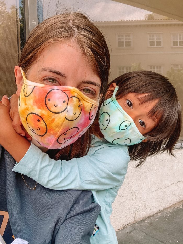 A mother and her son with masks on