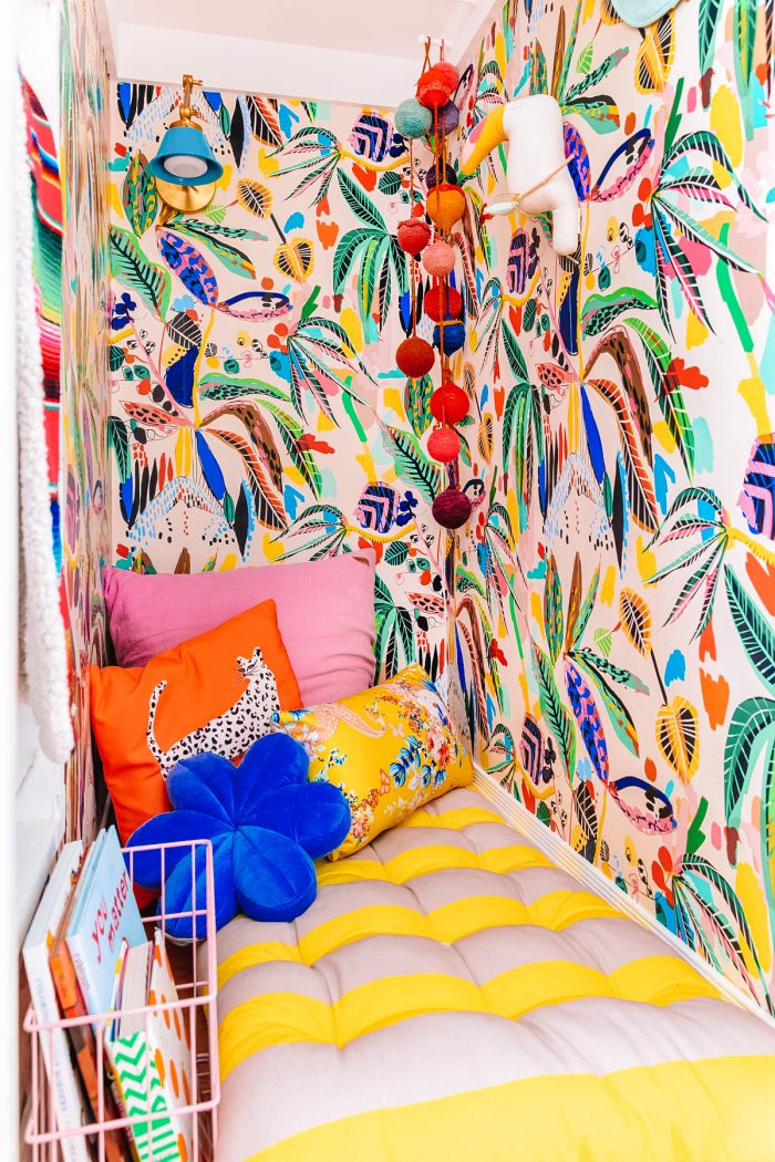 Closet with colorful wallpaper and pillows