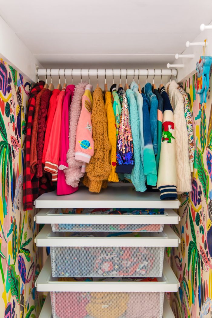 A closet with colorful jackets