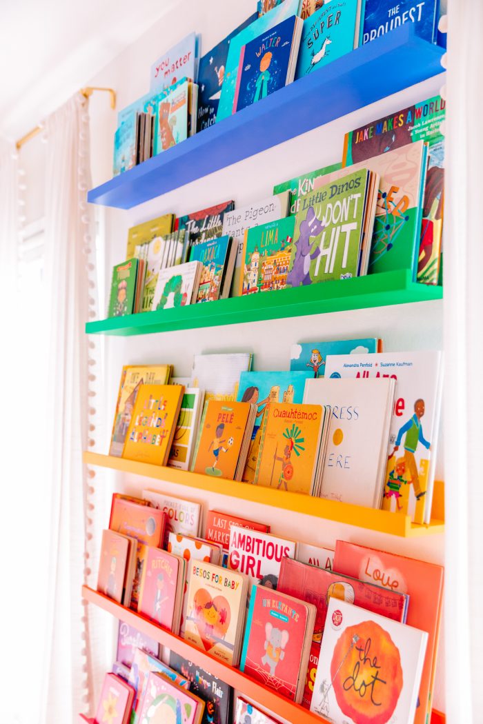 A rainbow shelf with books