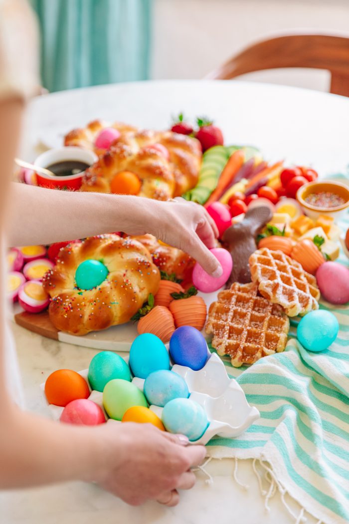 Easter brunch with a person holding an Easter egg