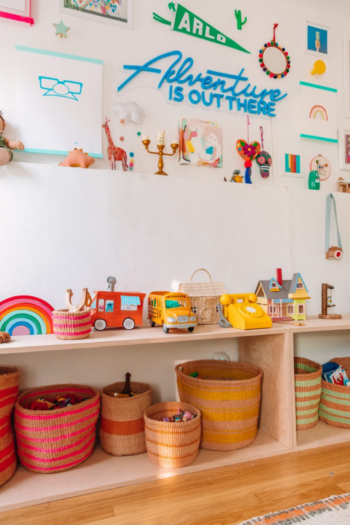 A room with colorful items on the shelf
