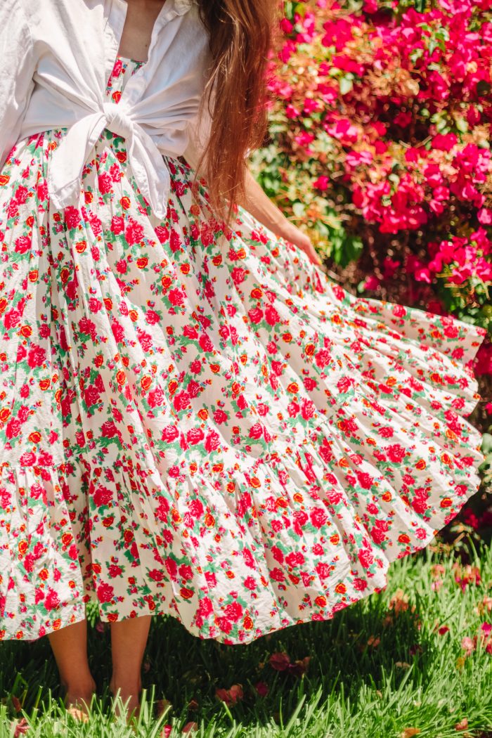 A woman wearing a flower skirt