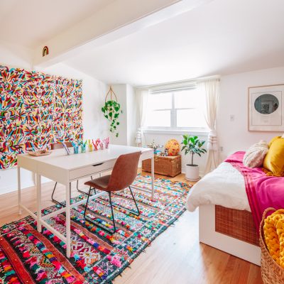 Colorful Home Office Guest Bedroom with Moroccan Rugs and Otomi Tapestry