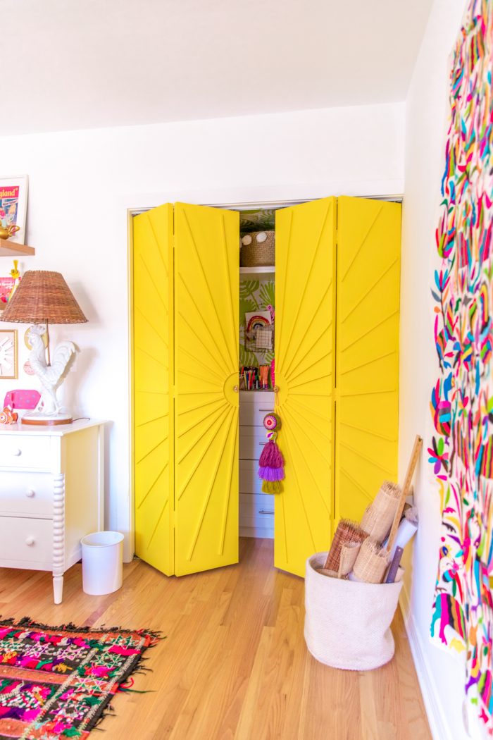 Yellow sun closet doors in a colorful home office