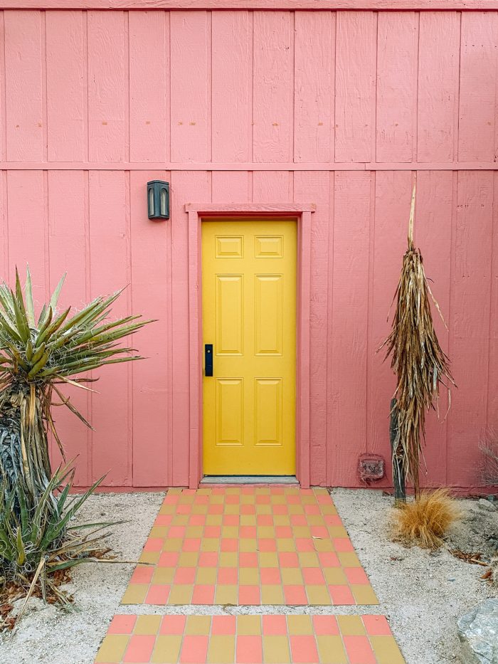 Pink House with Yellow Door at Oeste in Yucca Valley