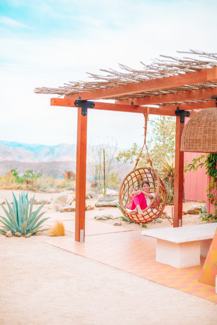 Hanging rattan chair at Oeste in Yucca Valley