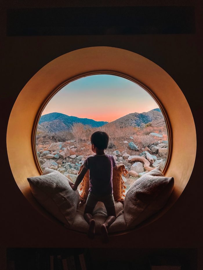 Circle window looking out on Yucca Valley desert