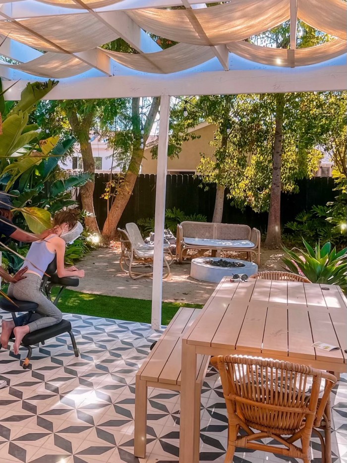 Massage in massage chair on patterned back patio