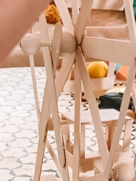 Popsicle stick Ferris wheel on a table