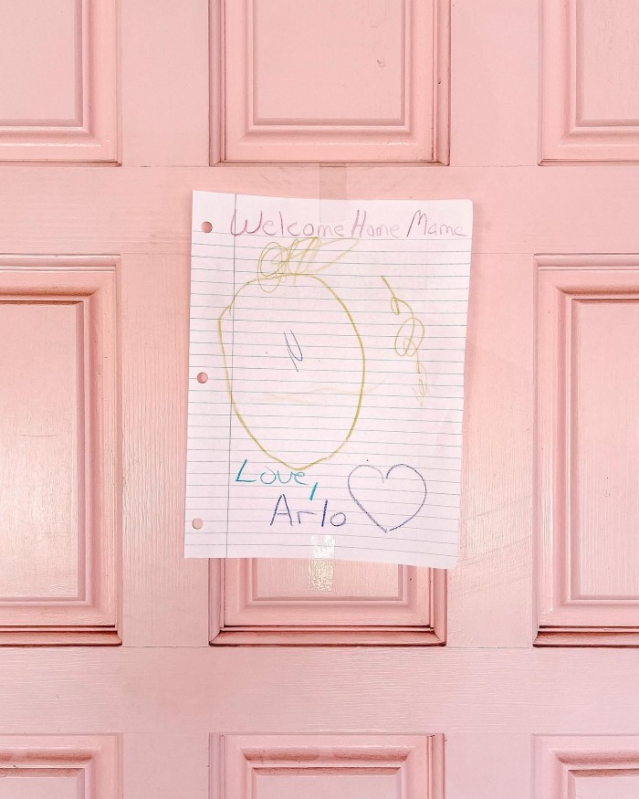 Homemade Welcome Home Sign on Pink Door