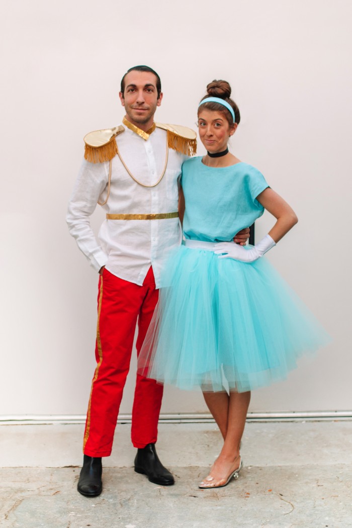 Couple dressed in Cinderella and Prince Charming Halloween costumes