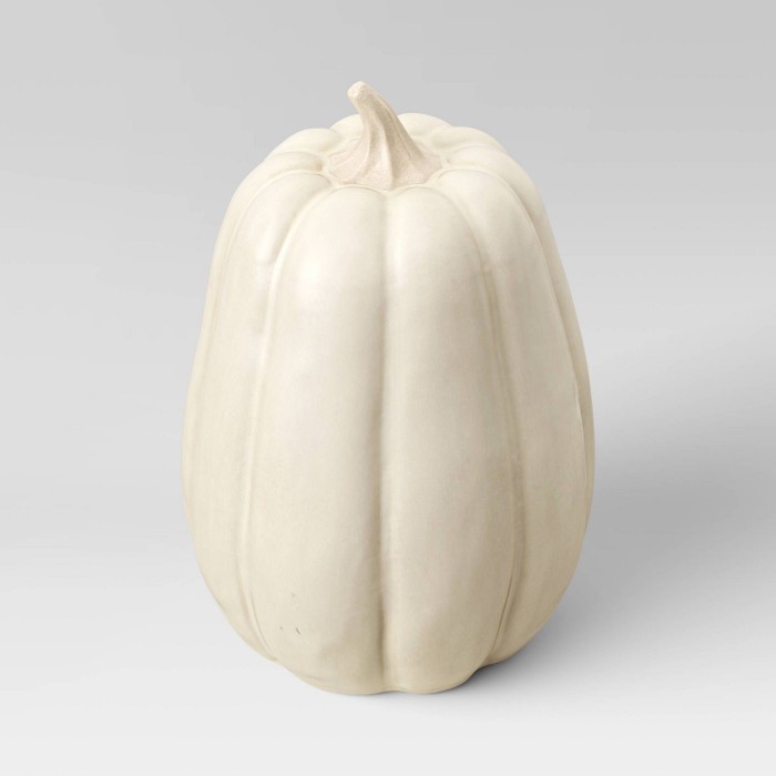 cream ceramic pumpkin on white background