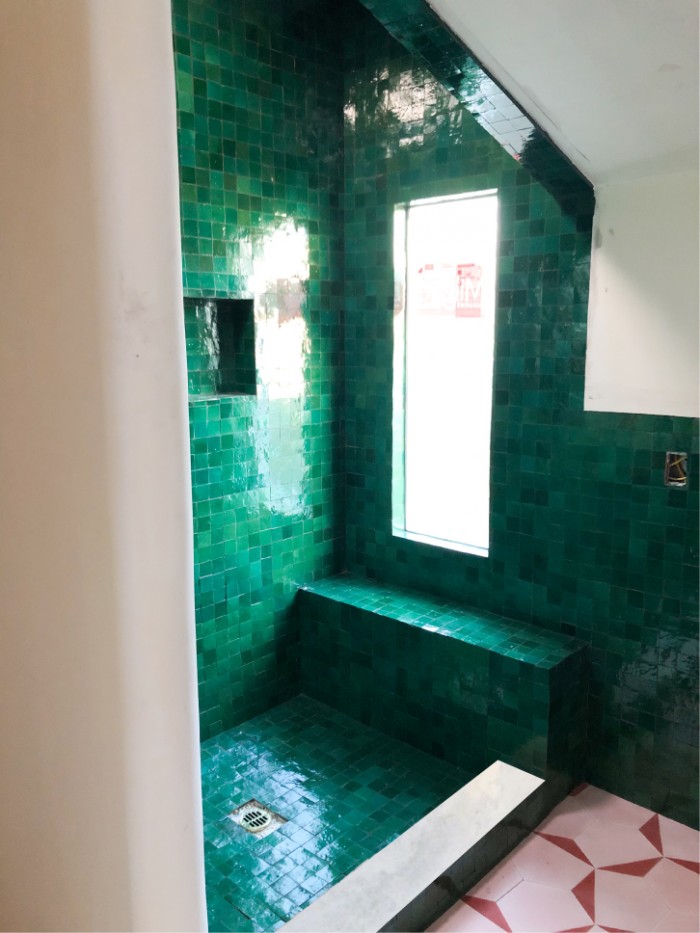 Green zellige tile shower with marble 