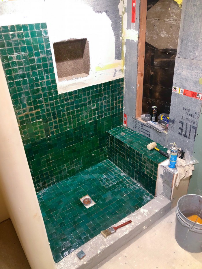 Under construction green zellige tile shower