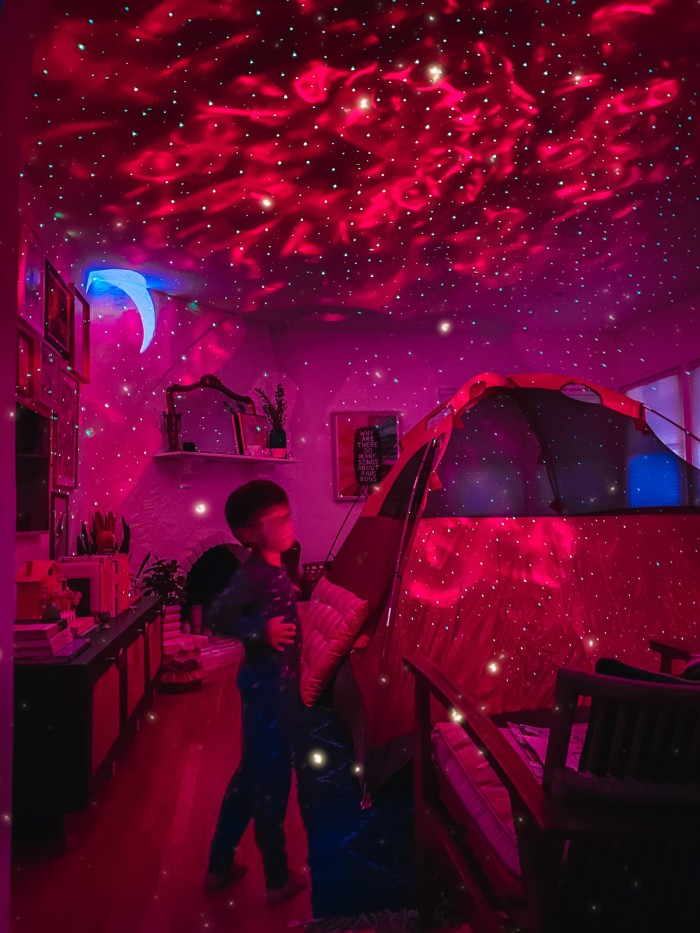 Red Galaxy Projector with tent in living room