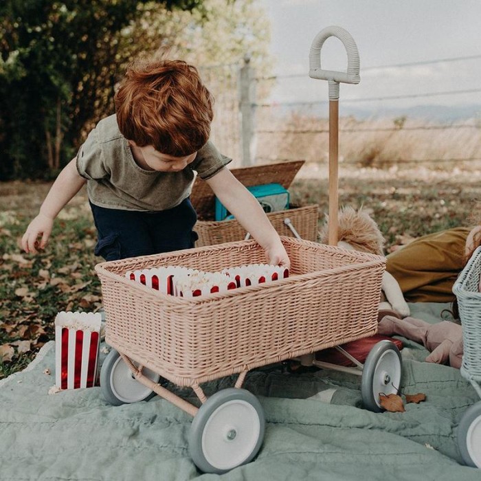 Pink Rattan Wagon with child reaching in