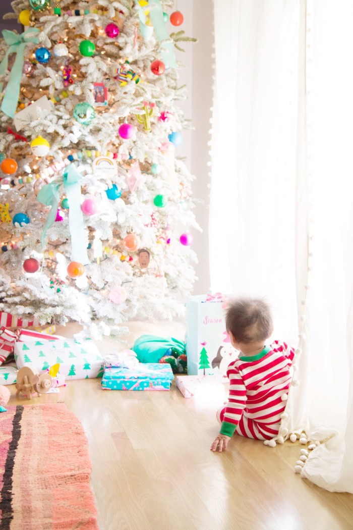 Baby looking at Christmas tree