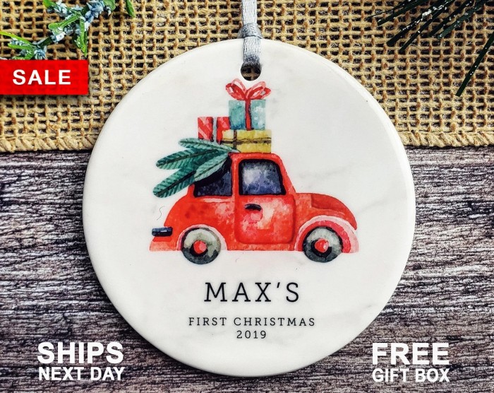baby's first christmas ornament with illustrated car