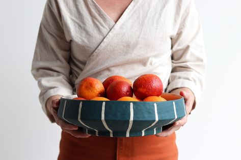 Blue and white pinstripe serving platter that is perfect for holding fruit